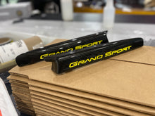 Load image into Gallery viewer, 2010 - 2013 Corvette C6 Grand Sport Carbon Fiber Painted Fender Emblems OEM GM - Labor Only