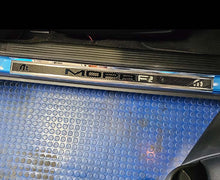 Load image into Gallery viewer, 2015-2024 DODGE CHALLENGER  CARBON FIBER DOOR SILLS WITH &quot;MOPAR&quot; POLISHED LETTERING W/ BLUE LED ILLUMINATION 2PC
